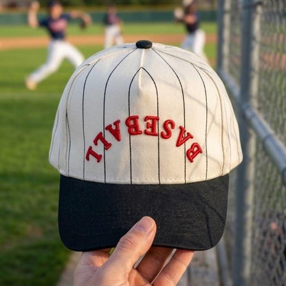 White and black baseball pinstripe hat with arched red embroidered BASEBALL lettering