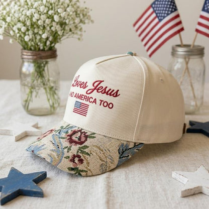 Side view of cream Christian hat showing floral-patterned brim and front embroidery