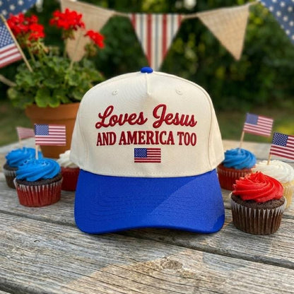 Standing front view of the cream and blue embroidered cap with Christian message and American flag