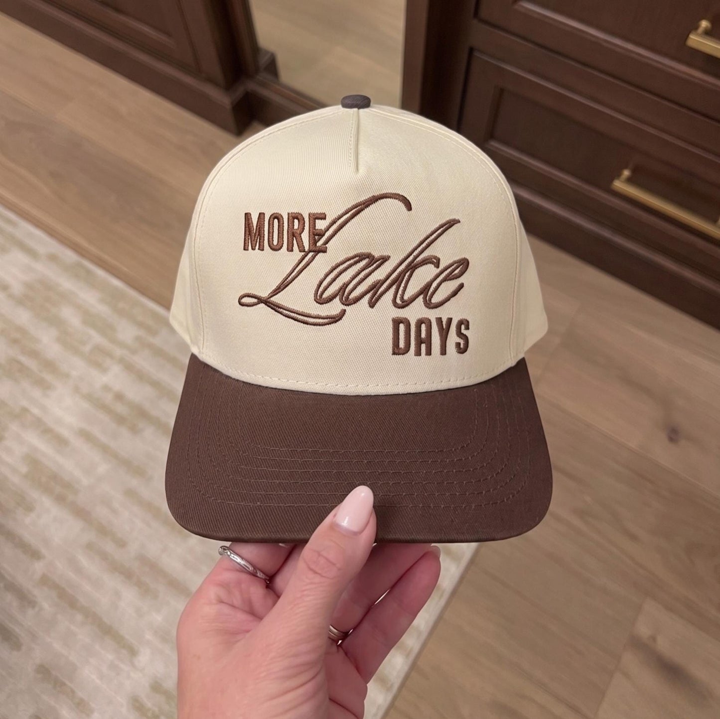 Cream and brown two-tone hat with embroidered More Lake Days lettering