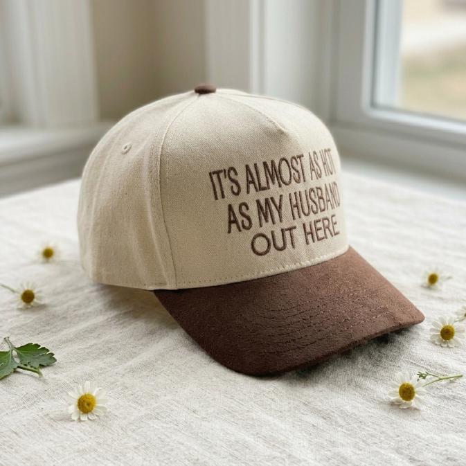 Angled view of two-tone hat showing the humorous husband quote