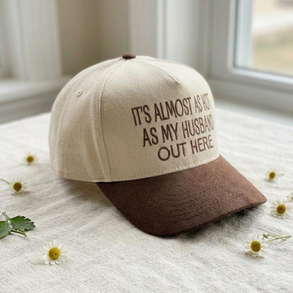 Angled view of two-tone hat showing the humorous husband quote