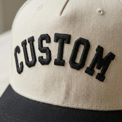 Close-up of dimensional black CUSTOM embroidery on beige hat