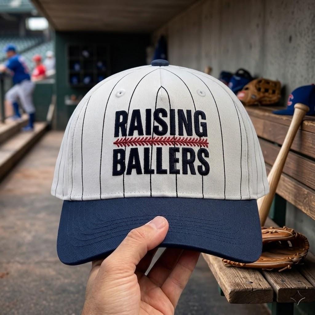 Close-up of Raising Ballers baseball hat embroidery and red stitch detail