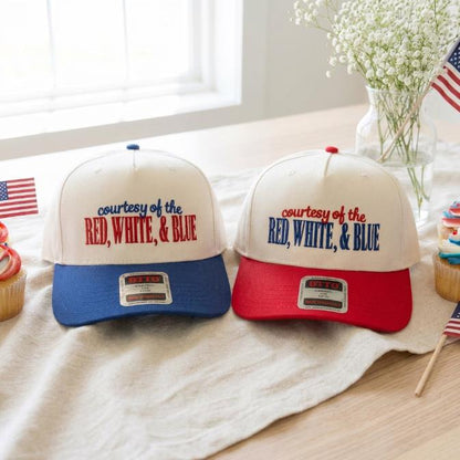 Two patriotic two-tone trucker hats with embroidered courtesy of the red white and blue lettering