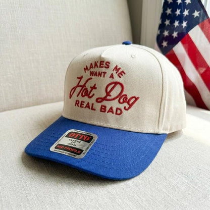 Angled view of cream and blue hot dog embroidered cap