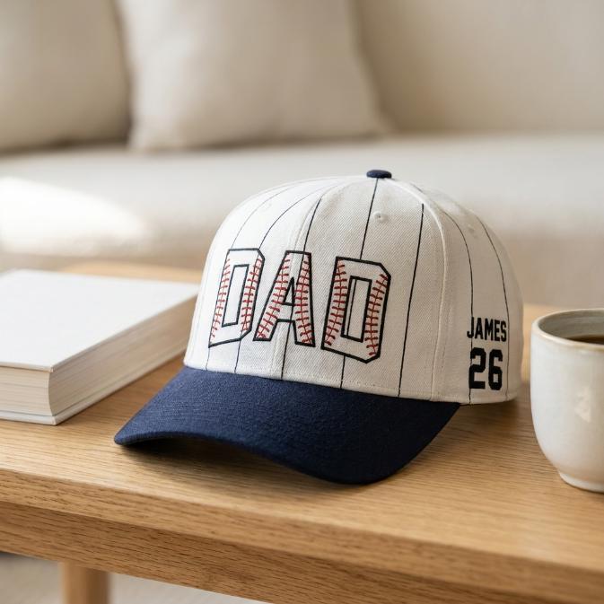 Pinstripe baseball hat with navy brim displayed on a wooden table