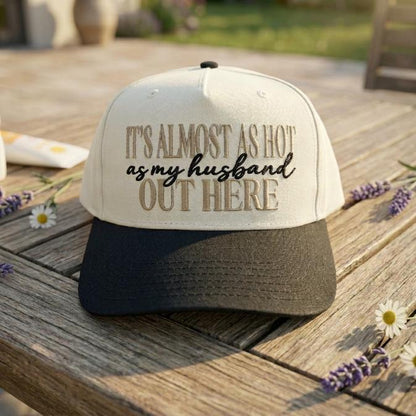 Funny husband quote trucker cap displayed outdoors on a garden path