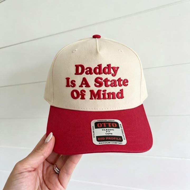 Cream and red two-tone trucker hat with Daddy Is a State Of Mind embroidery