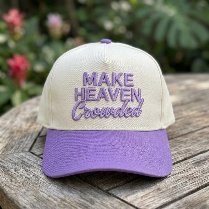 Cream and purple two-tone trucker cap with Make Heaven Crowded embroidery
