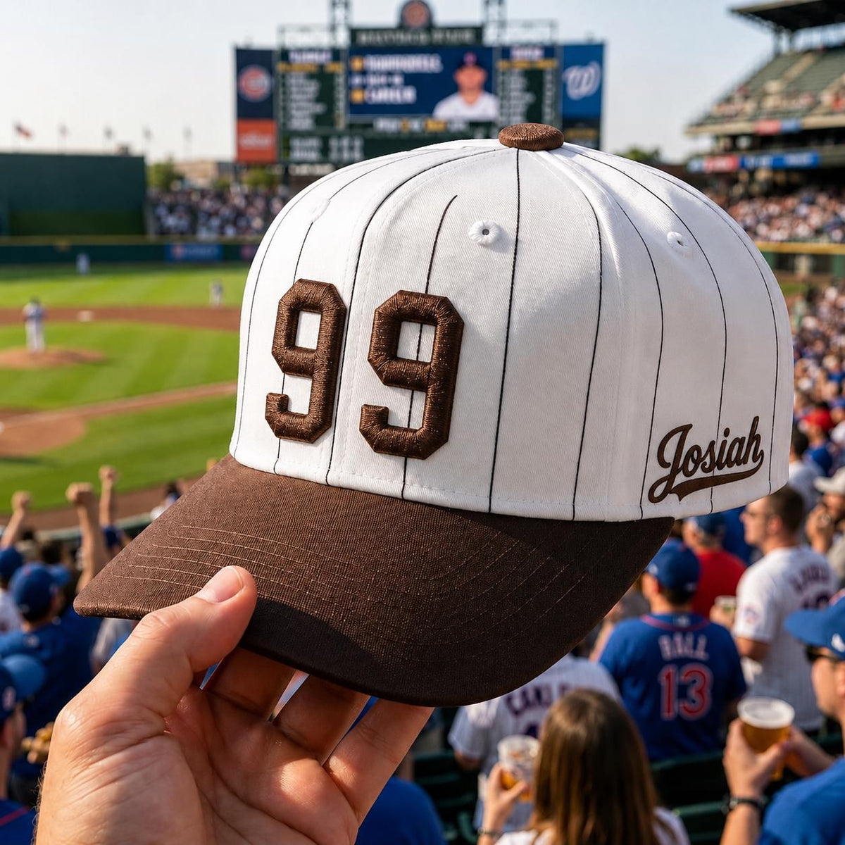 Personalized white pinstripe baseball hat with brown brim, embroidered number 99, and Josiah name detail