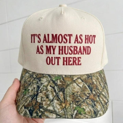 Front view of embroidered humor hat with cream crown and camouflage brim