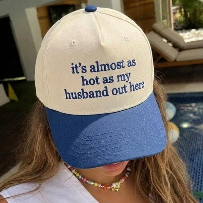 Two-tone cream and blue trucker hat with the quote it’s almost as hot as my husband out here