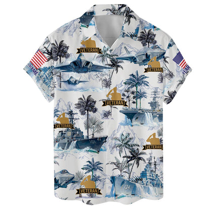 Flat lay front view of a blue and white veteran Hawaiian shirt with aircraft and naval ship graphics