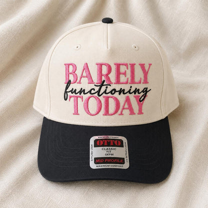 Barely Functioning Today statement hat displayed against a light fabric background