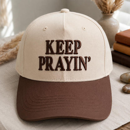 Front view of cream and brown embroidered Keep Prayin’ hat