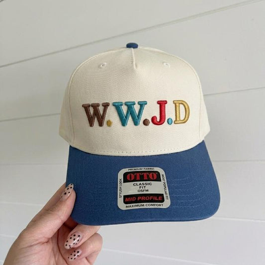 Two-tone cream and blue trucker hat with colorful W.W.J.D embroidered lettering