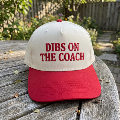 Dibs on the Coach hat displayed outdoors on a wooden table