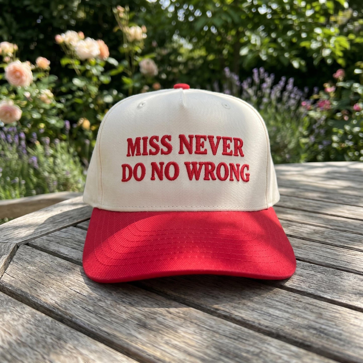 Front view of embroidered Miss Never Do No Wrong trucker cap