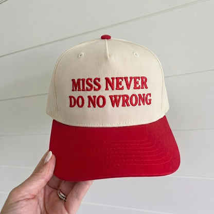 Cream and red two-tone trucker hat embroidered with Miss Never Do No Wrong