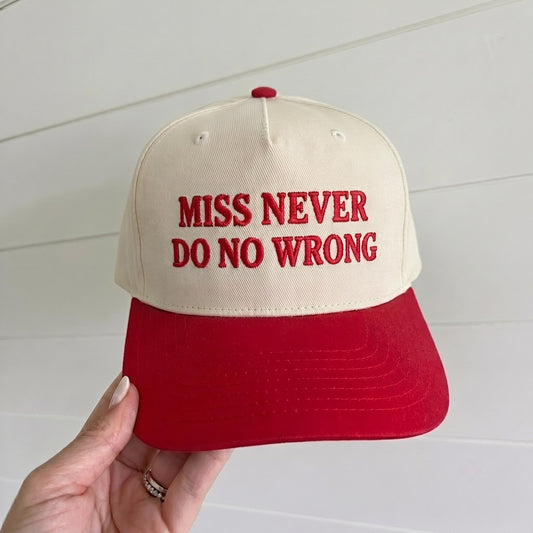 Cream and red two-tone trucker hat embroidered with Miss Never Do No Wrong