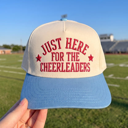 Light crown and blue brim embroidered cheerleader hat reading Just Here for the Cheerleaders with star accents