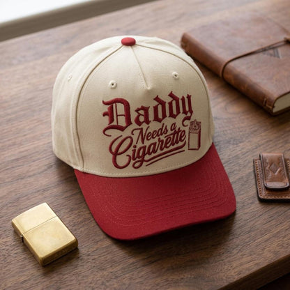 Front view of cream and red Daddy Needs a Cigarette embroidered hat