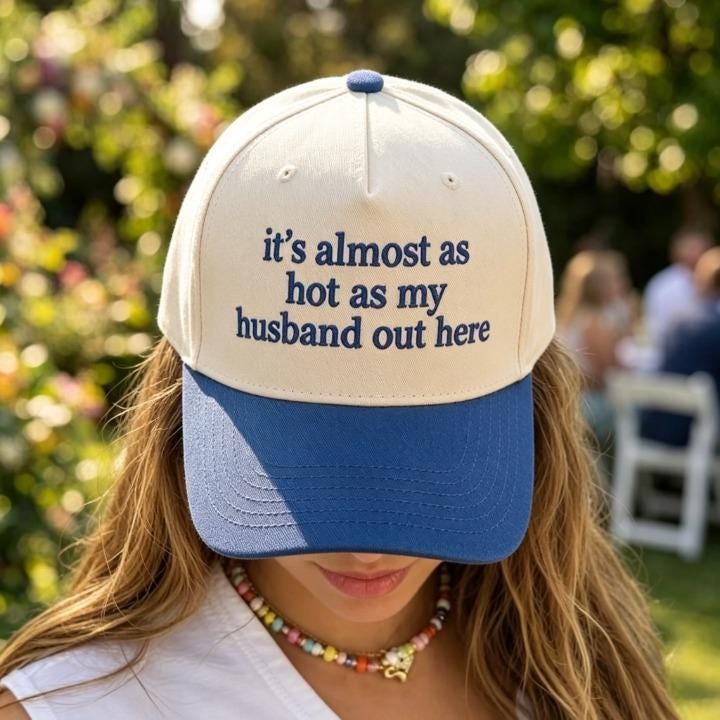 Funny embroidered quote hat modeled outdoors by a pool