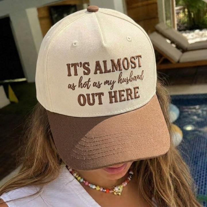 Two-tone cream and brown trucker hat with embroidered husband quote