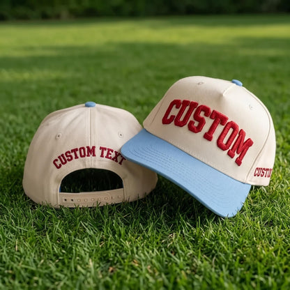 Custom text baseball cap with raised red lettering and light blue brim on grass