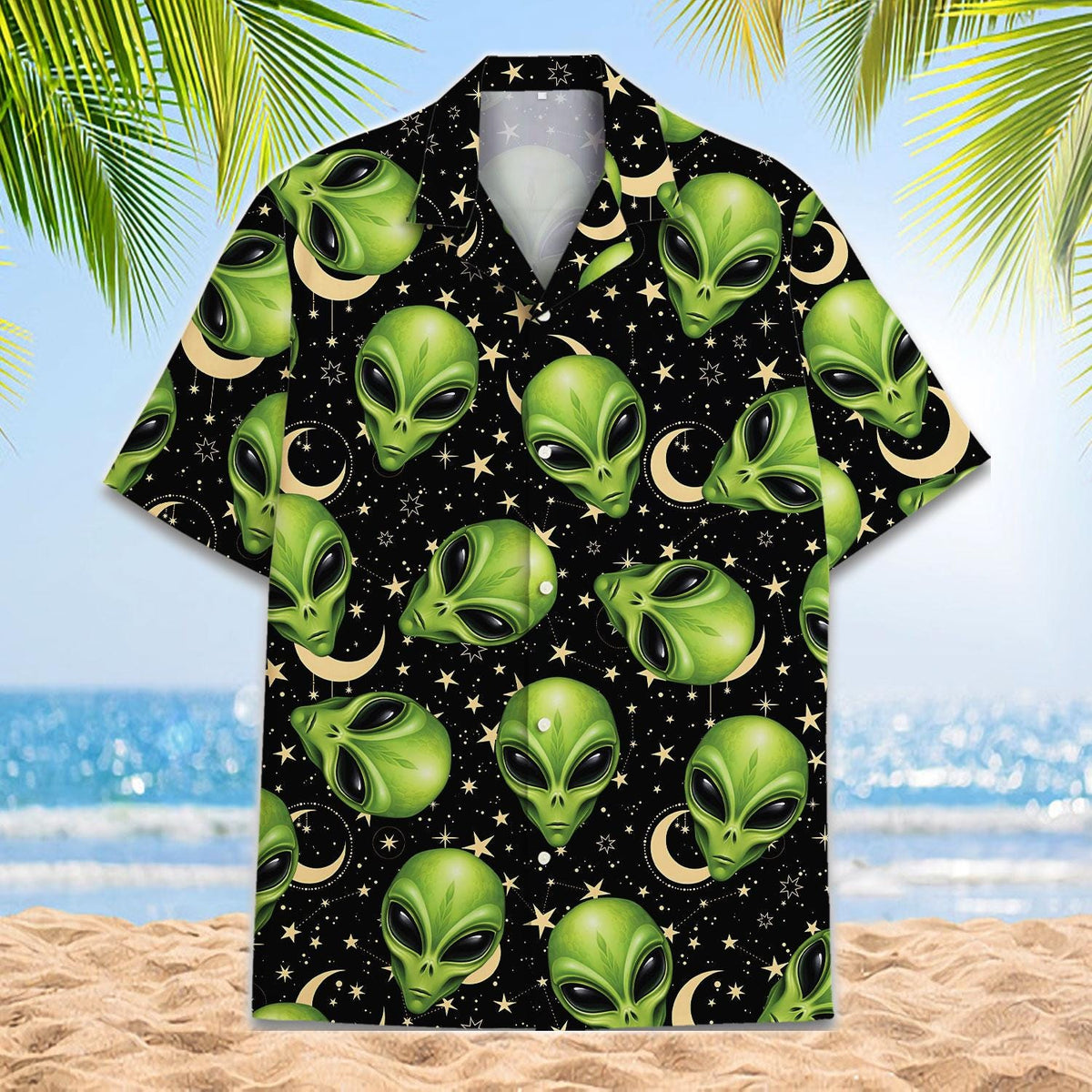 Front view of a black Hawaiian shirt covered in green alien faces and celestial symbols