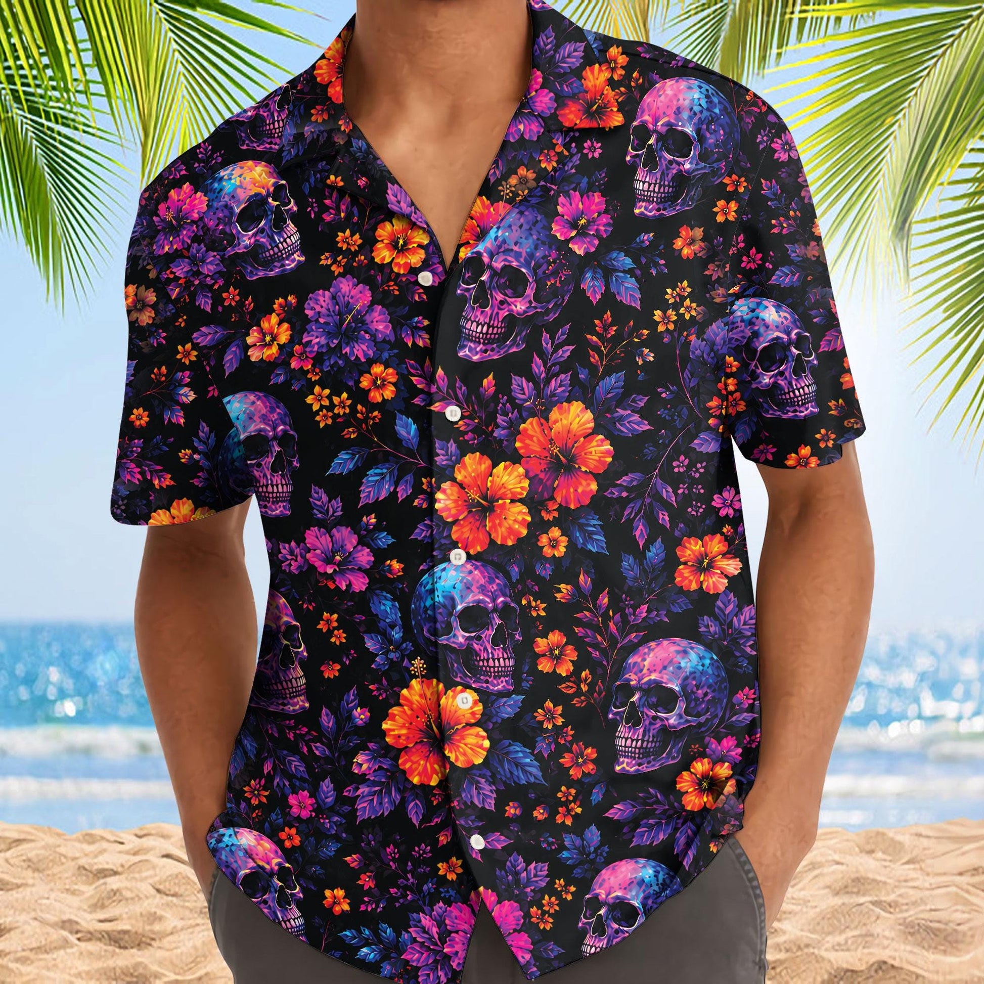 Model wearing a vivid skull floral Hawaiian shirt with button front