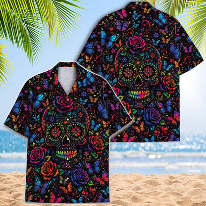 Two matching sugar skull Hawaiian shirts displayed against a tropical beach background