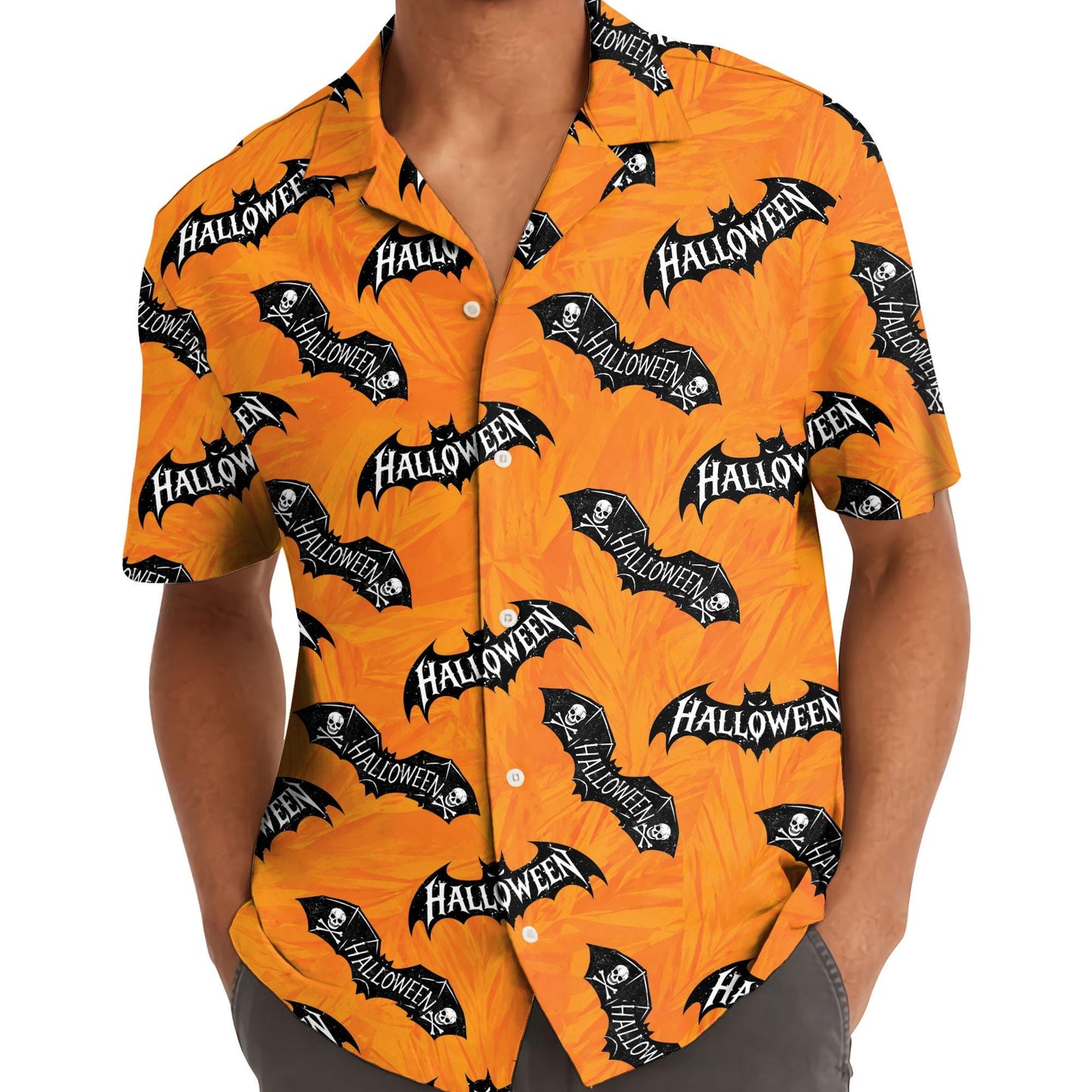 Person wearing an orange Halloween shirt with black bat print and button front