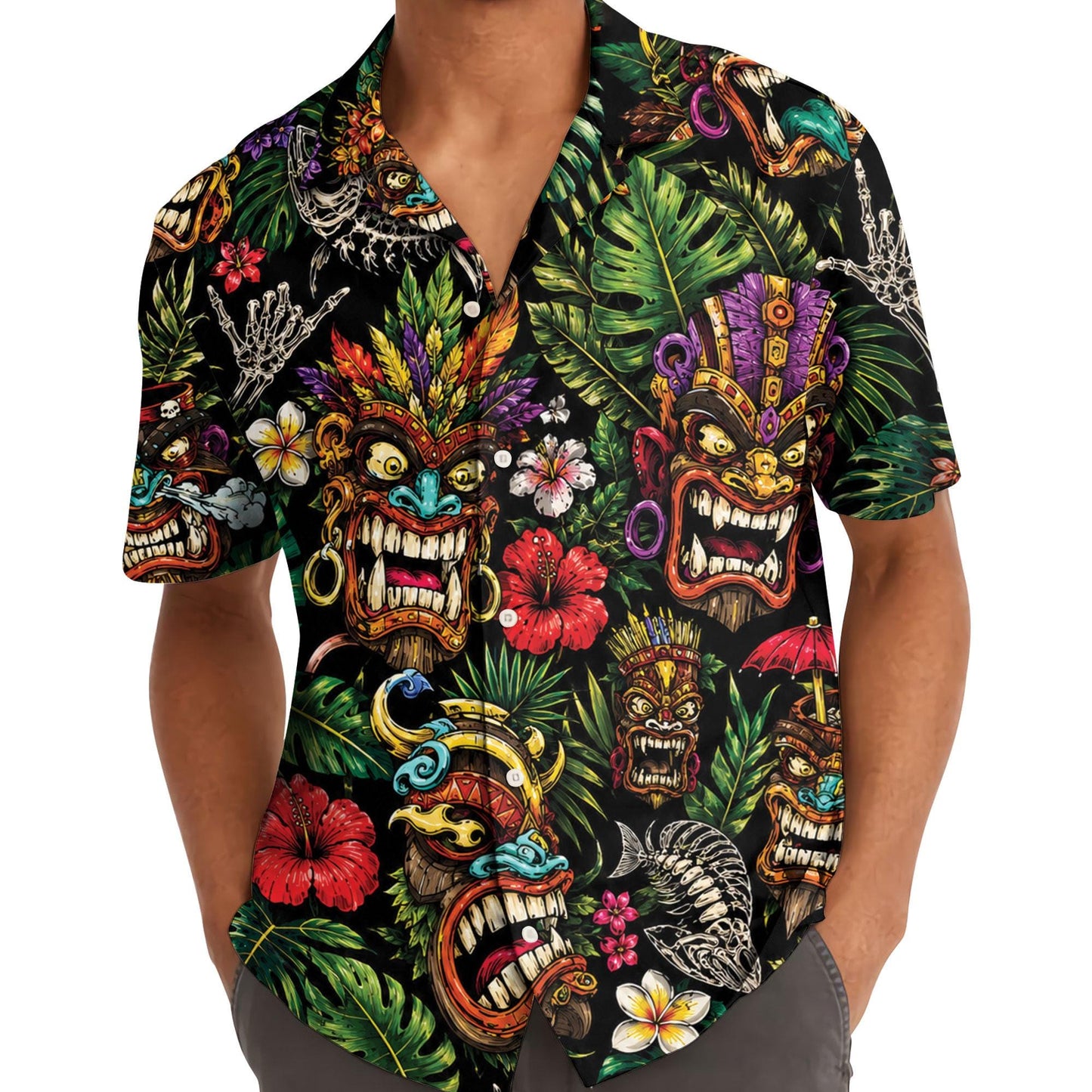 Model wearing a colorful tiki mask Hawaiian shirt with tropical foliage print