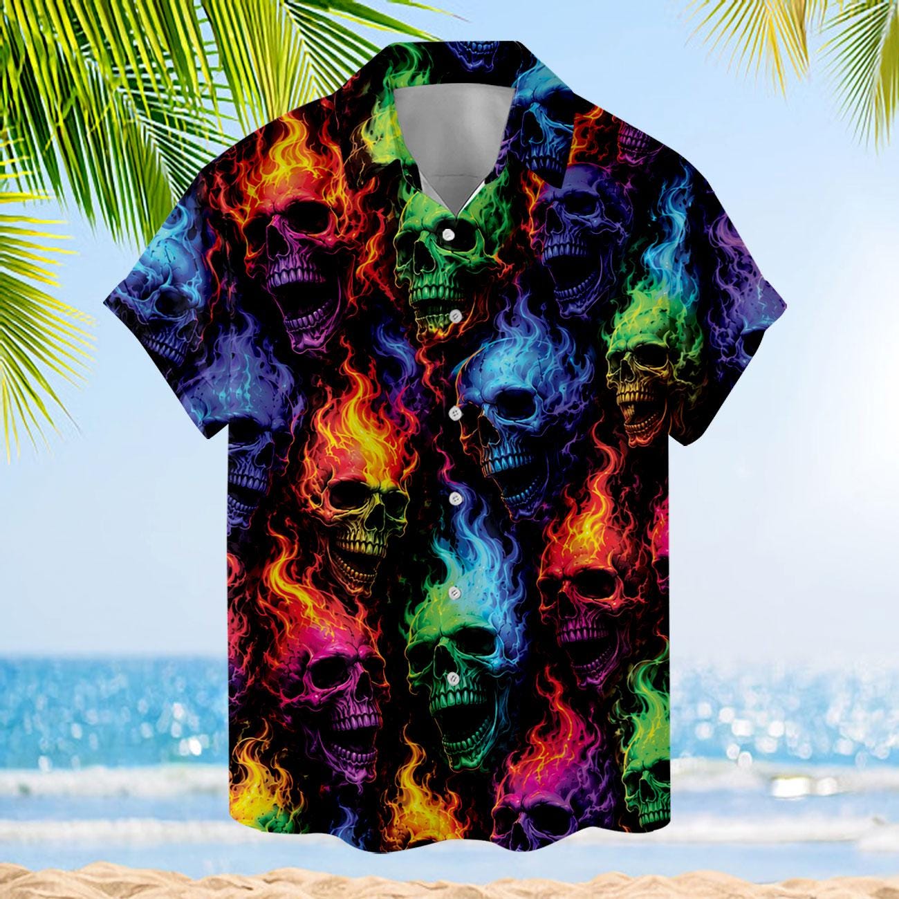 Colorful flaming skull Hawaiian shirt displayed against a tropical beach background