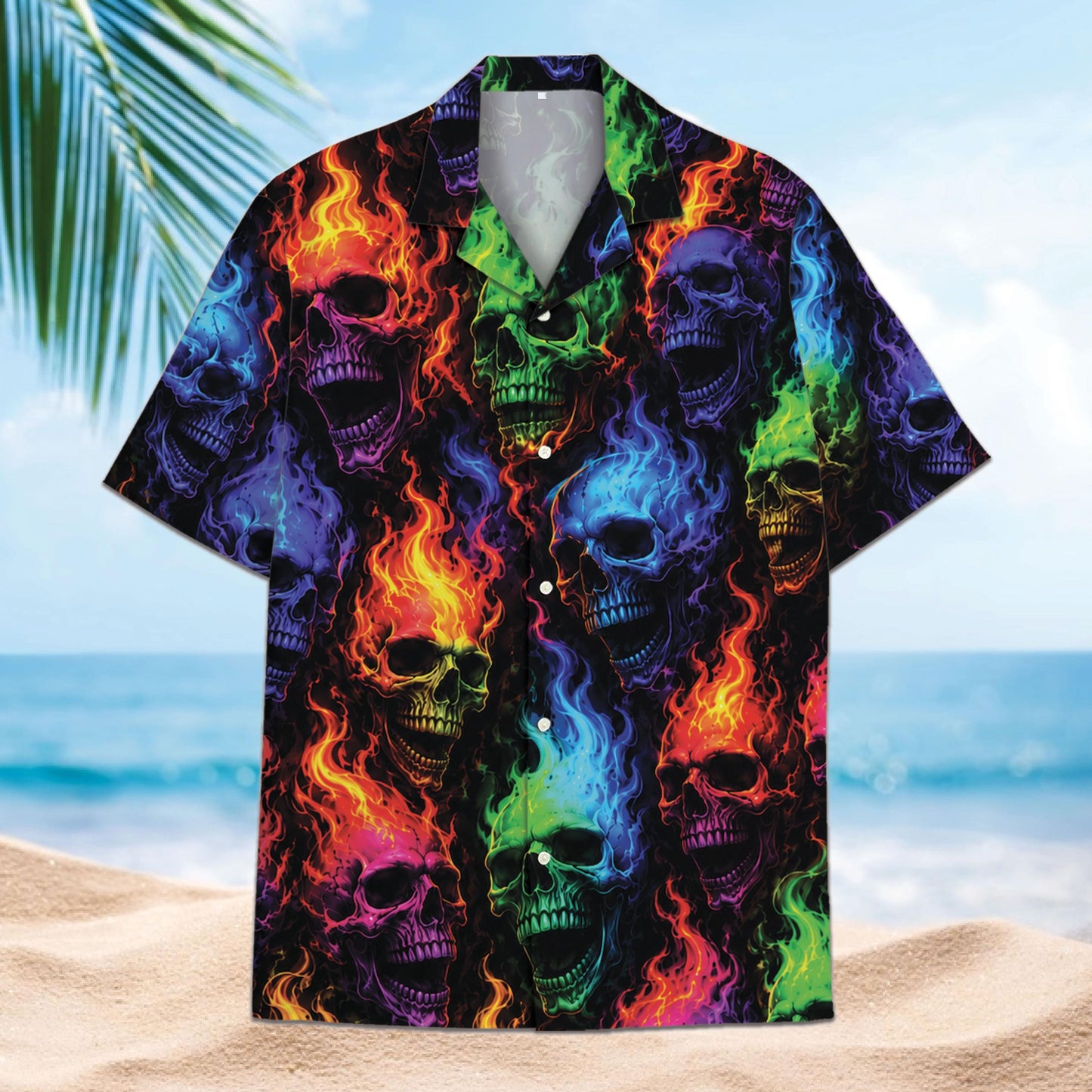 Front view of multicolor flaming skull short sleeve button-up shirt on a beach