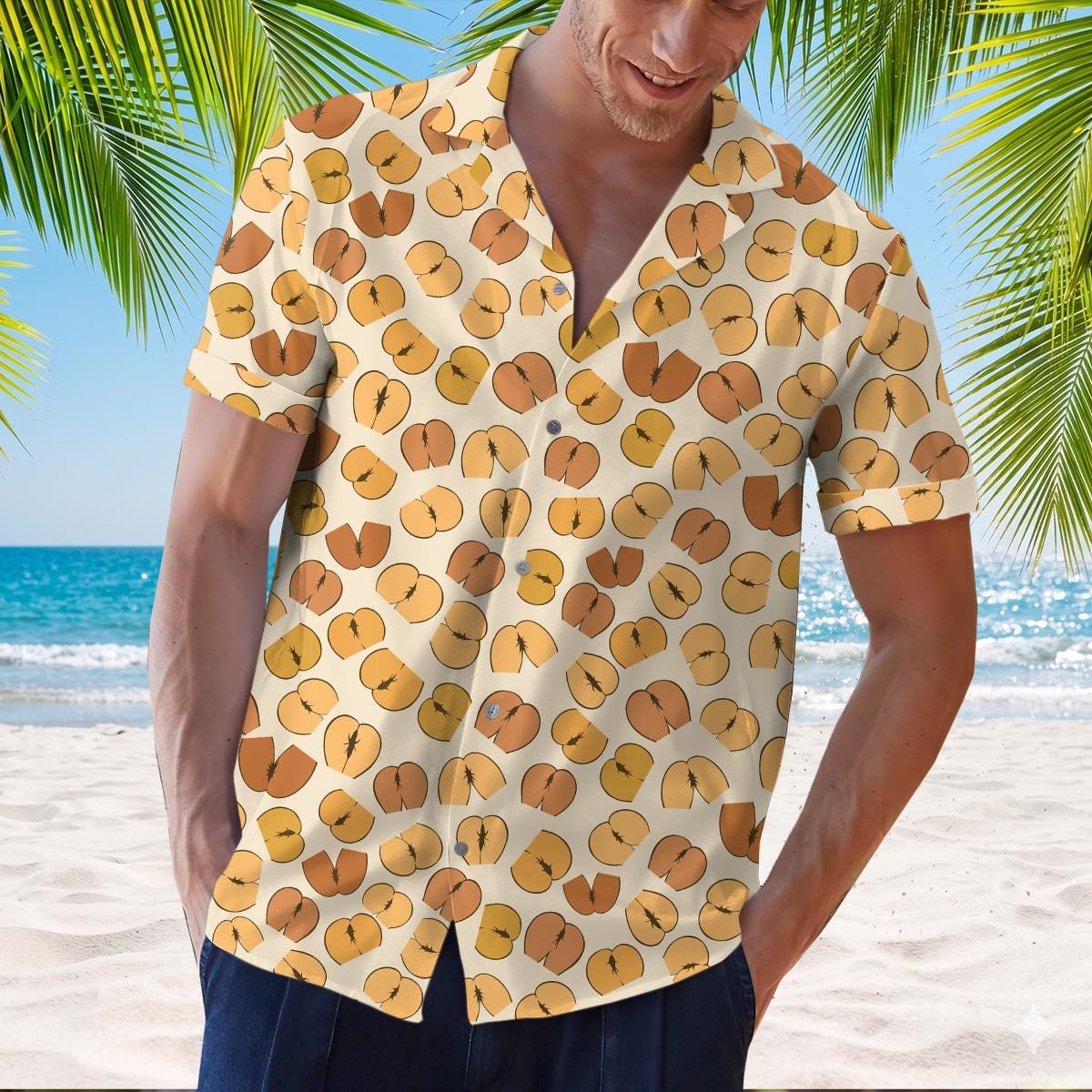 Model wearing a gold and brown tropical leaf print Hawaiian shirt