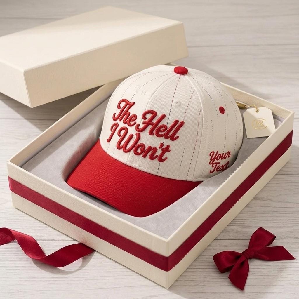 Red pinstripe baseball cap presented in a gift box