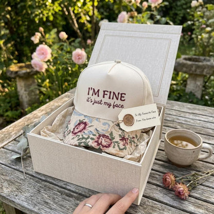Floral message hat presented in a gift box outdoors