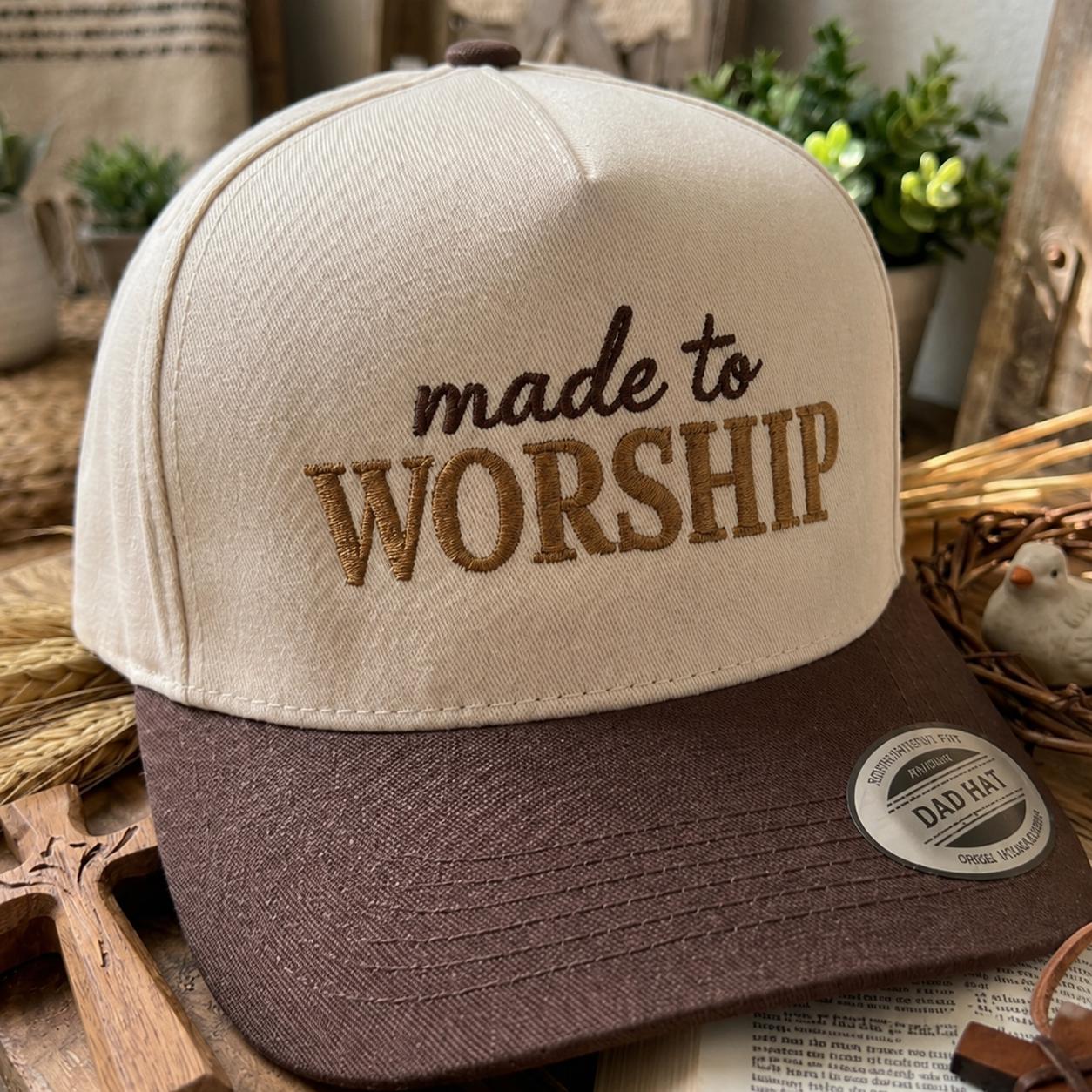 Close-up of a cream embroidered worship hat with a brown bill