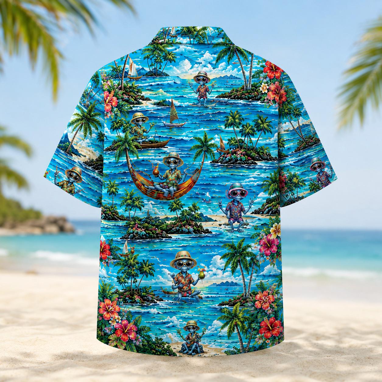 Back view of a tropical Hawaiian shirt with ocean scenery, sailboats, palm trees, and island flowers