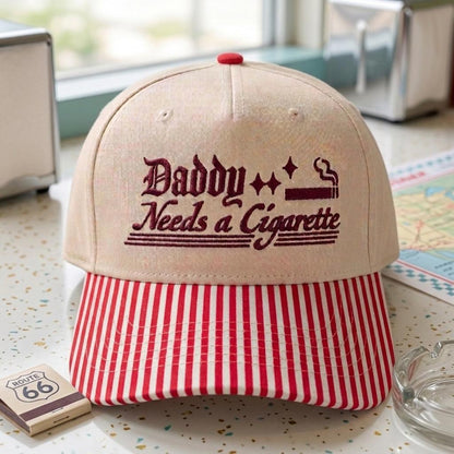Khaki embroidered Daddy Needs a Cigarette hat with red striped bill