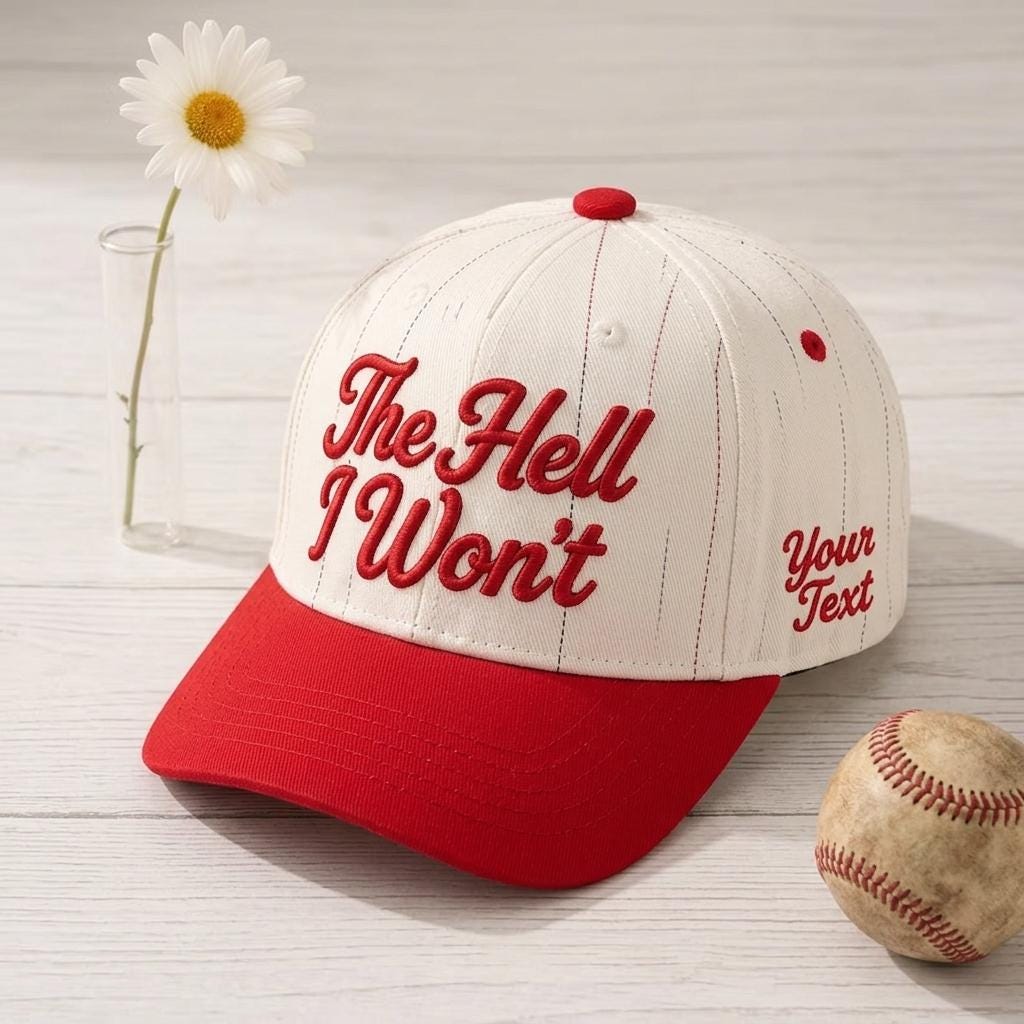 White pinstripe baseball cap with red bill and red “The Hell Won’t” script