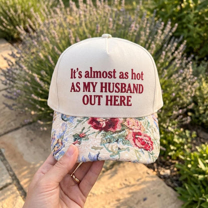 Cream embroidered hat with floral brim and funny husband quote outdoors