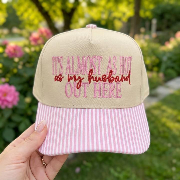 Front view of funny embroidered khaki hat with pink striped bill
