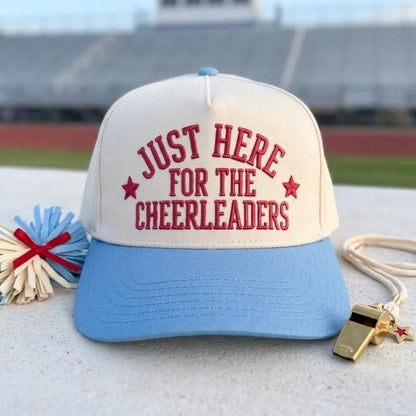 Two-tone hat reading Just Here for the Cheerleaders with light blue brim