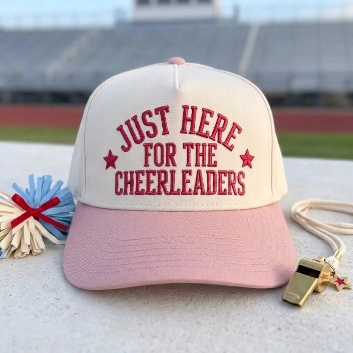 Cheerleader support hat with pink brim and embroidered front message