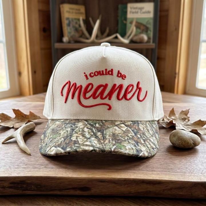 White hat with red “i could be meaner” embroidery and woodland camouflage brim