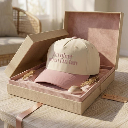 Embroidered two-tone hat presented in a decorative gift box